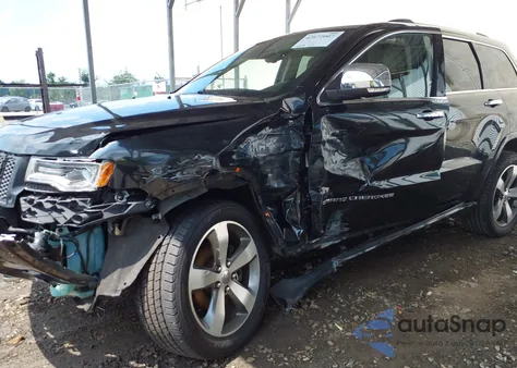 2014 Jeep Grand Cherokee Overland z USA, uszkodzony, nr VIN 1C4RJFCG4EC355890